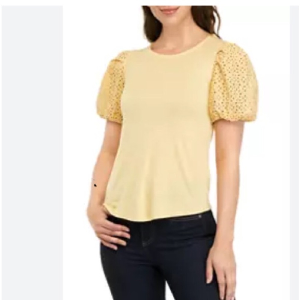 Pale yellow casual tee.  Has nice puffy floral cut out sleeves.